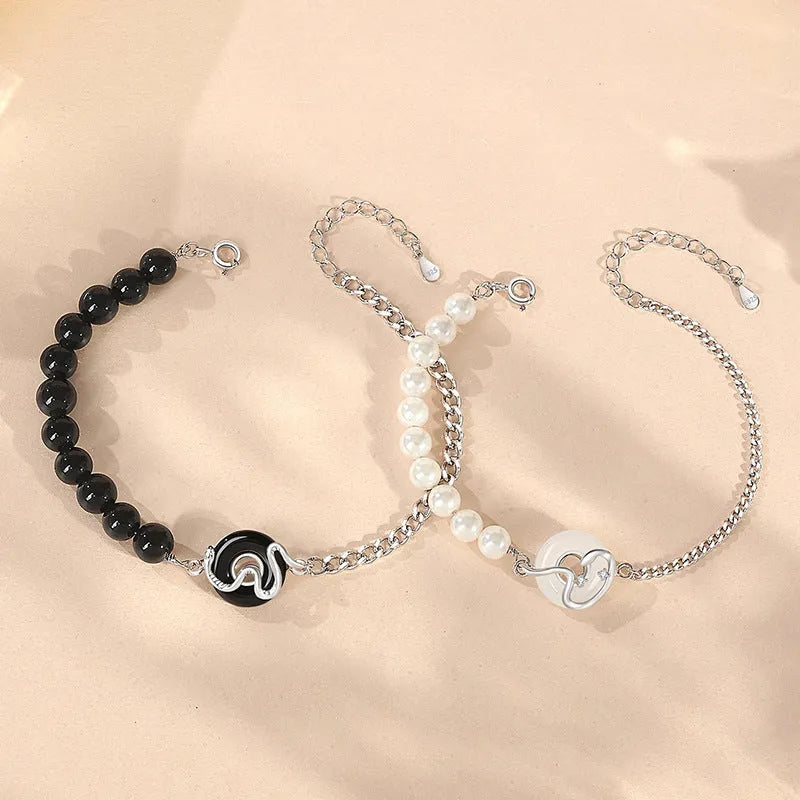 925 sterling silver couple bracelet with safe buckle, snake zodiac design, and obsidian pearl details in New Chinese style.