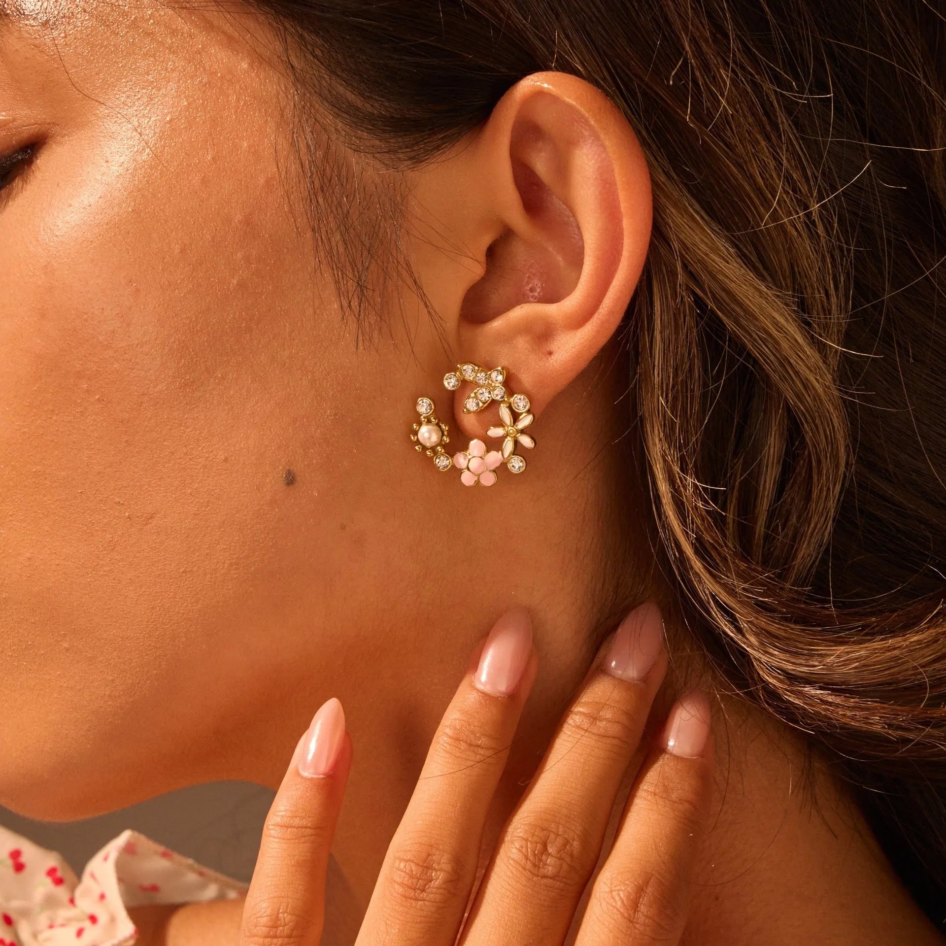 A pair of flower-shaped petal stud earrings with colourful oil finish and 18K electroplating on stainless steel.