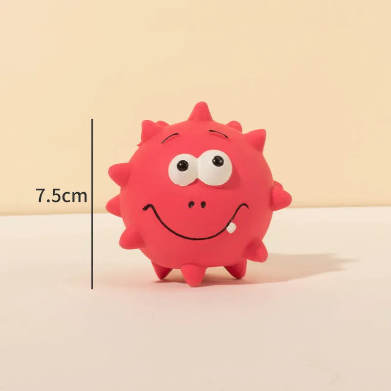 Four colourful squeaky dog balls with textured surfaces and cute faces