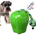 Green and red apple-shaped plastic dog toy with hollow centre for treat dispensing