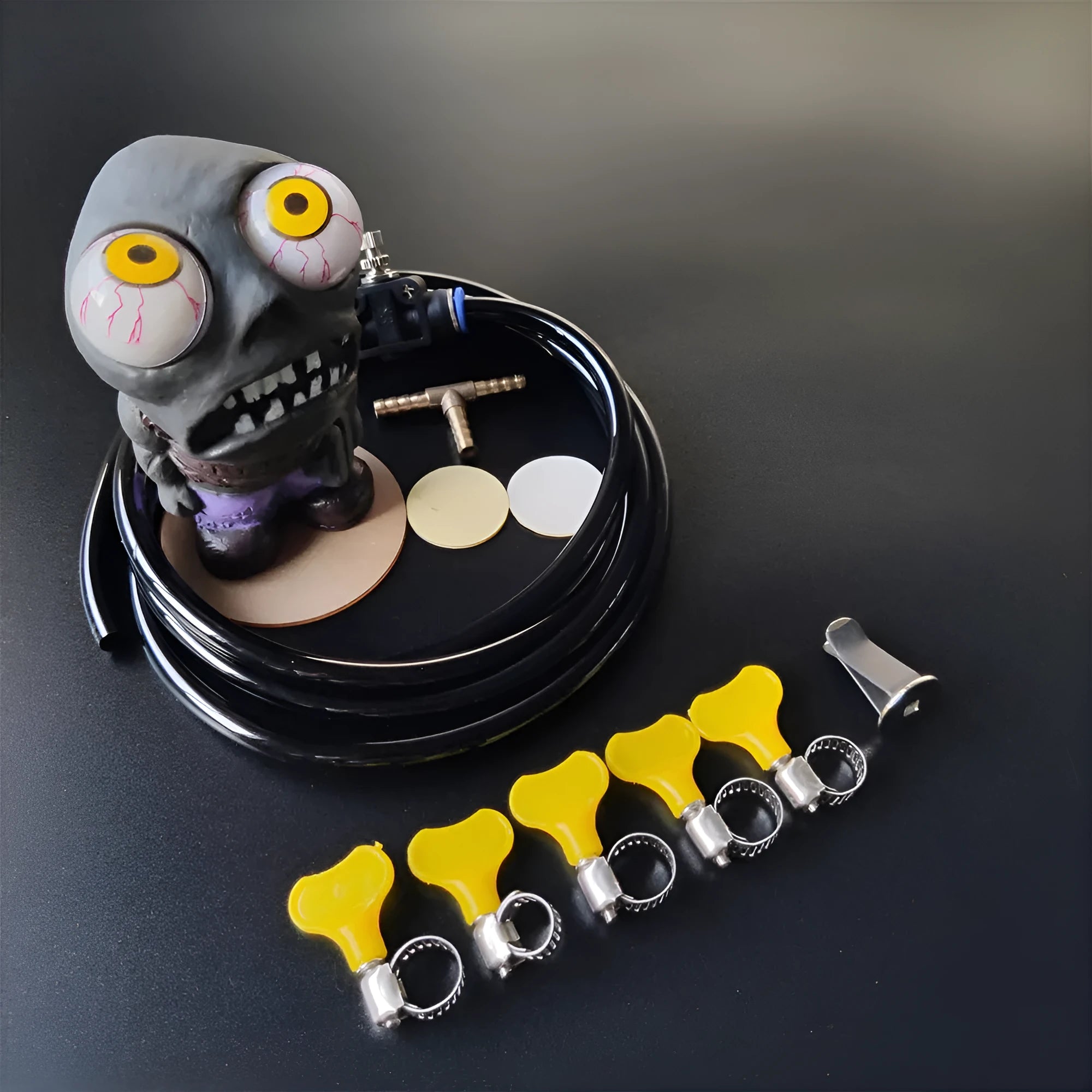 Turbo car blow-off valve decoration kit with explosive eye doll, pressure valve, copper tube, and clips.
