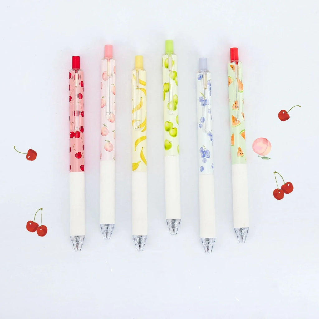 Three fruit scented press-action pens with 0.5mm quick-drying black refills on white background