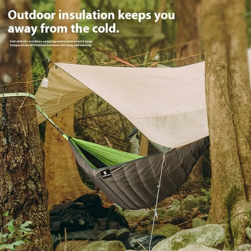 Army green outdoor camping hammock sleeping bag with compression sack, shown unrolled to display its size.