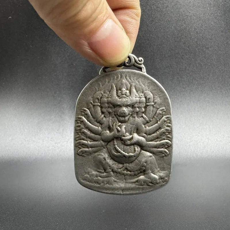 Iron metal pendant with Chinese geometric design depicting Yamantaka Aryaacalanatha deity