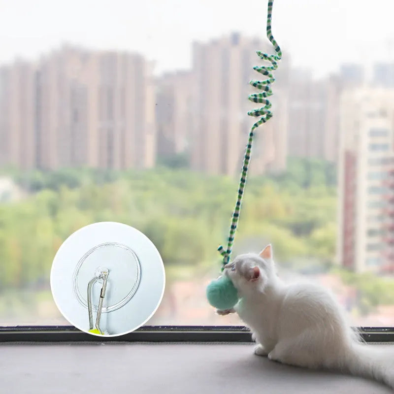 Hanging cat toy set with suction cup, colourful inflatable ball, and bell stick for kitten play.