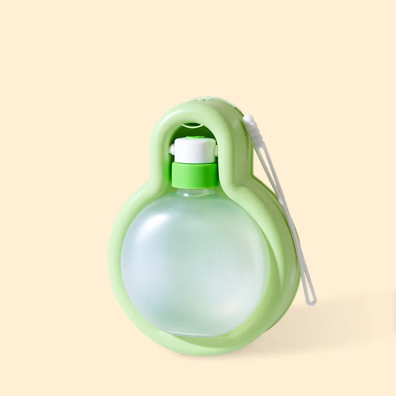 Green dog travel water bottle with built-in silicone drinking bowl, shown with bowl extended.