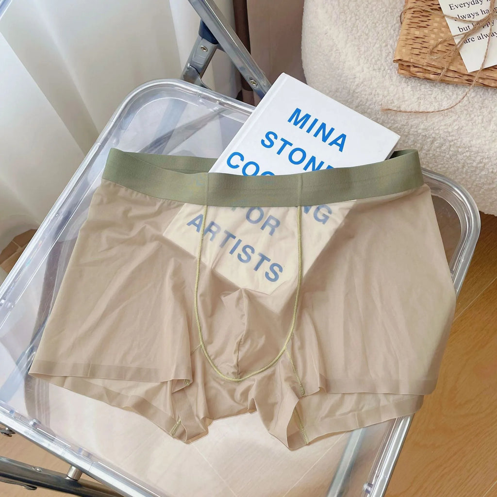 Men's thin seamless boxer shorts in quick-dry nylon fabric showing breathable construction and body shaping design