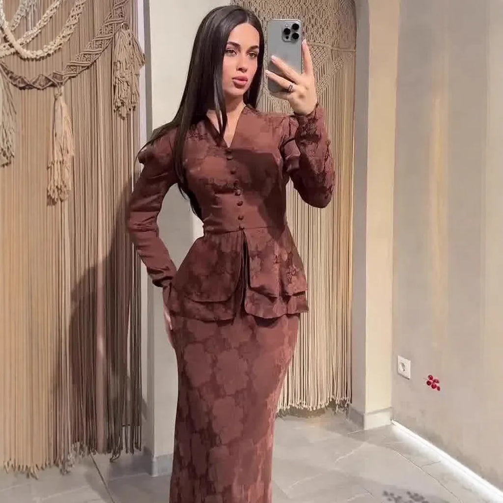 Women's dark brown artistic retro dress with plant pattern and button detailing showing long sleeves and fake two-piece styling