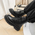 Men's black frosted leather platform ankle boots with a side zip and high-top design.