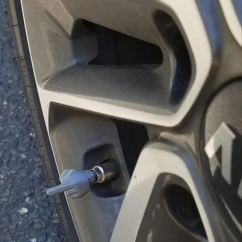 Four latex tyre valve caps showing black and skin colour options for vehicle dust protection
