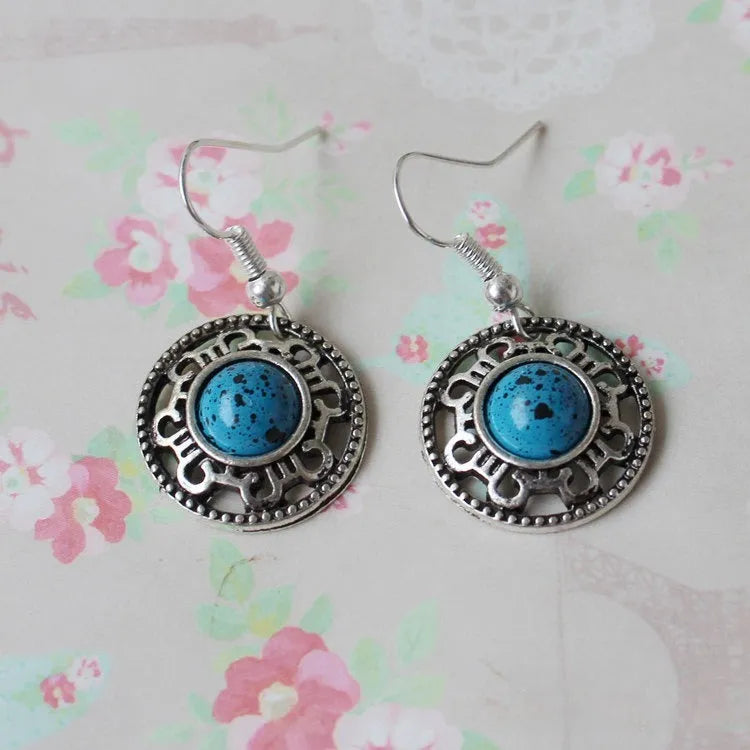 Miao silver ethnic earrings with turquoise geometric flower disk and auspicious patterns