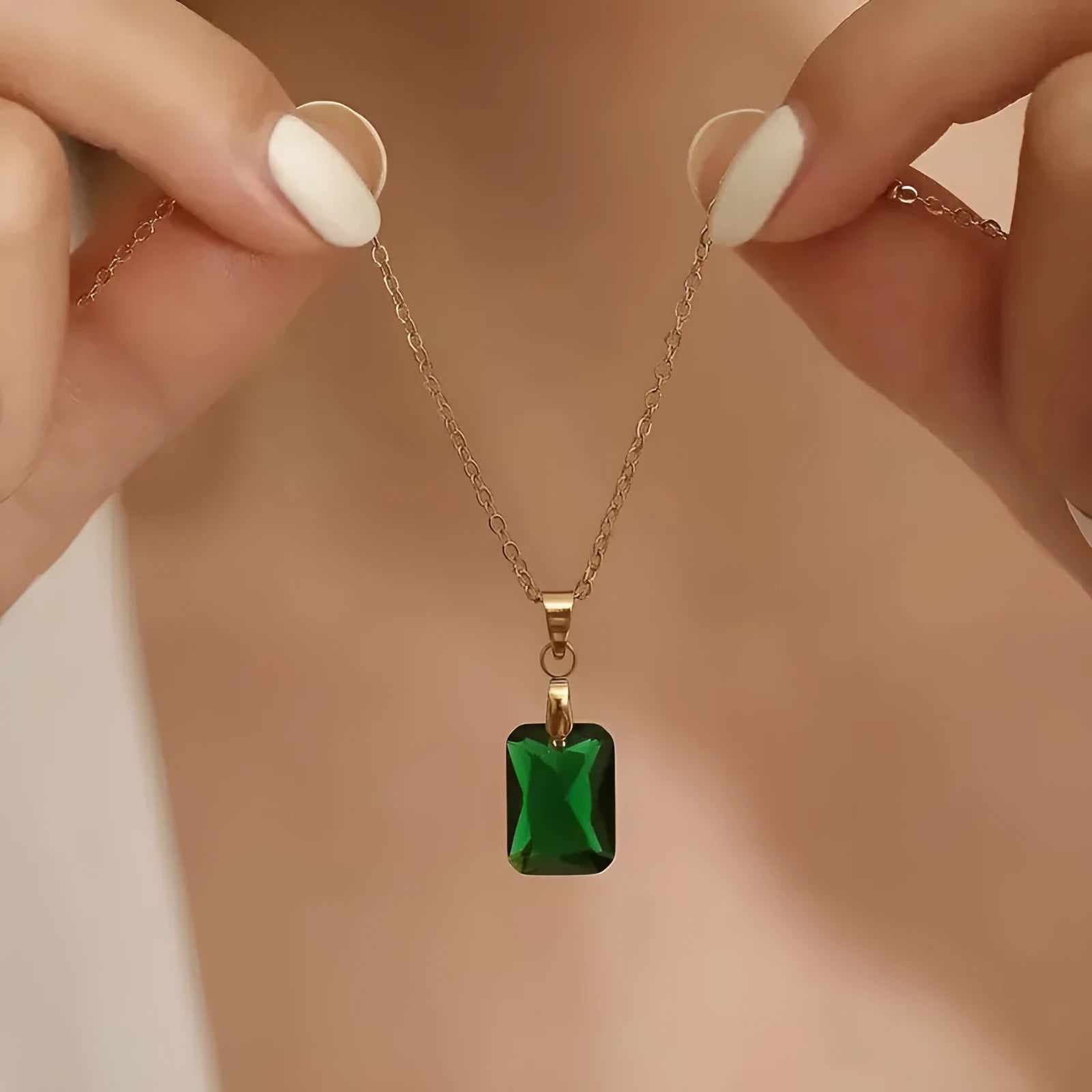 Copper rectangular geometric pendant necklace on an O-ring chain in a retro green colour.
