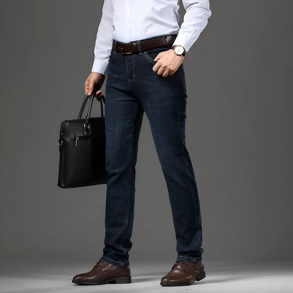 Women's straight leg stretch jeans in K276 blue denim, shown in a loose fit on a model.