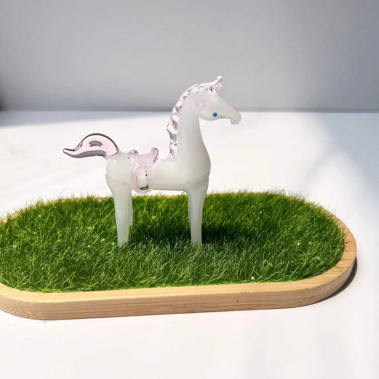 Glazed ceramic horse figurine decoration in modern simplicity style on a desk.