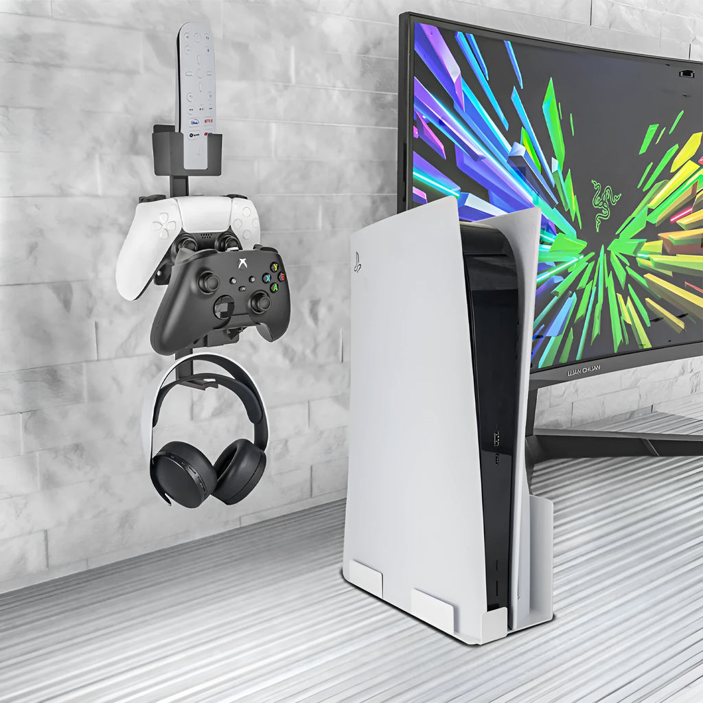 White wall-mounted plastic hook holding a game controller and remote control