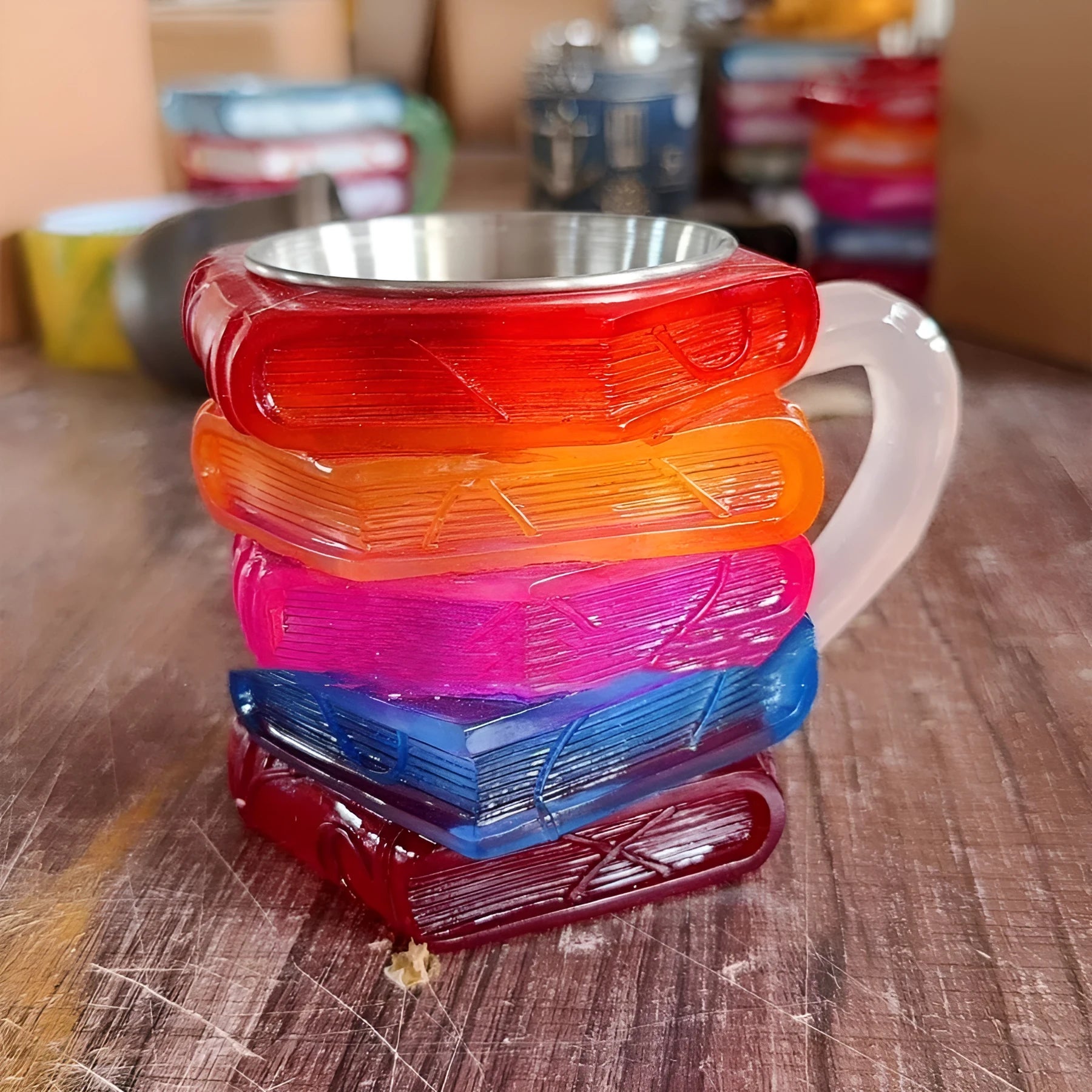 Resin coffee cup with painted bookmark design measuring 13x10x10cm