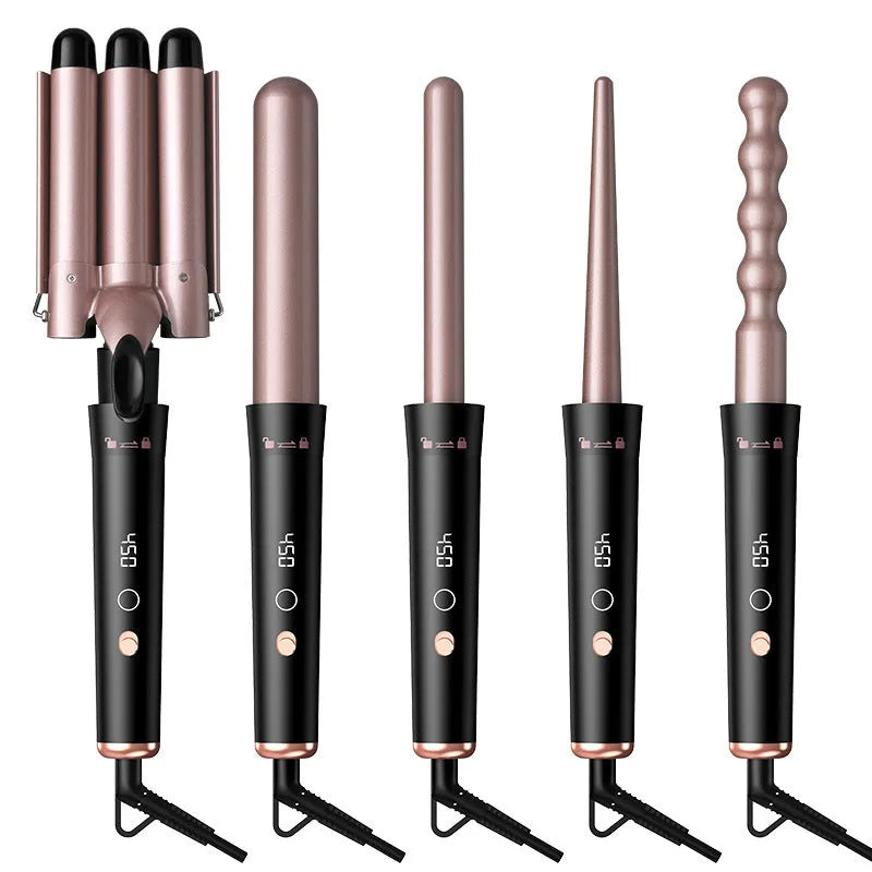 Rose gold hair curler with LCD display, replacement tubes, and heat-resistant gloves on a table.