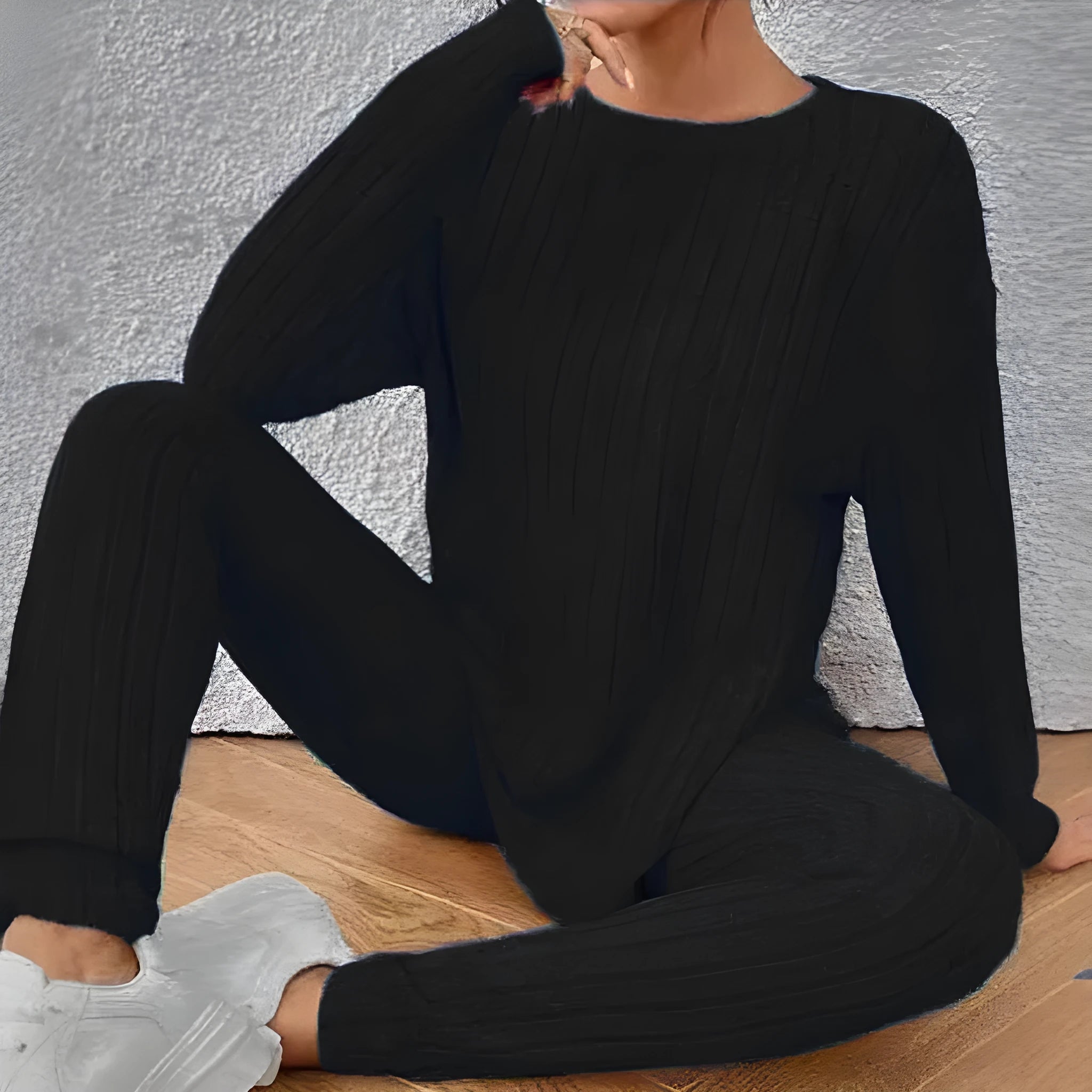 Black sunken stripe two-piece lounge set for women, showing top and pants.