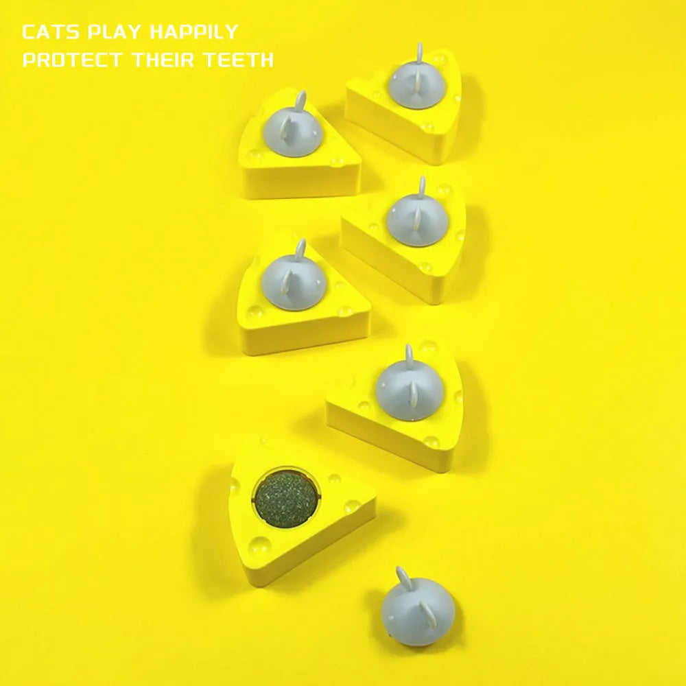 Yellow catnip toy ball with silvervine and a natural cheese flavour, includes a cat stick and wall treat holder.