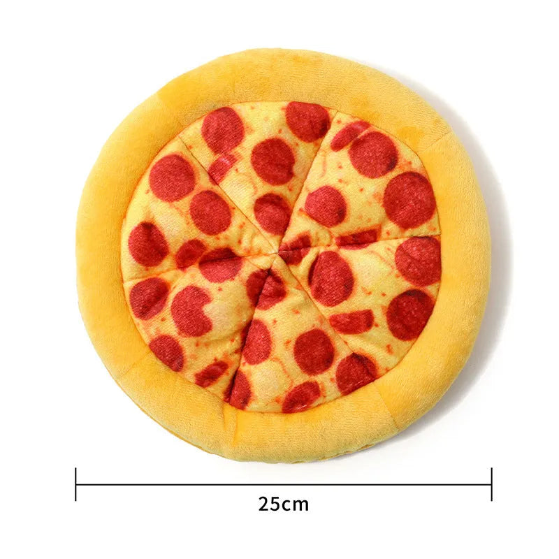 Yellow pizza slice shaped soft plush dog chew toy with squeaker on a white background.