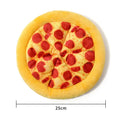 Yellow pizza slice shaped soft plush dog chew toy with squeaker on a white background.