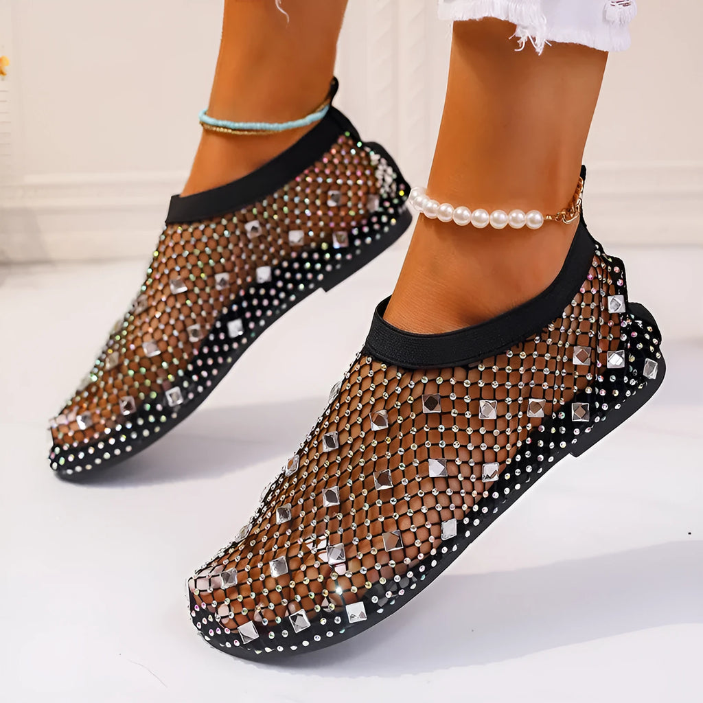 Women's flat mesh sandals with colourful rhinestone decoration on the upper and a round toe.