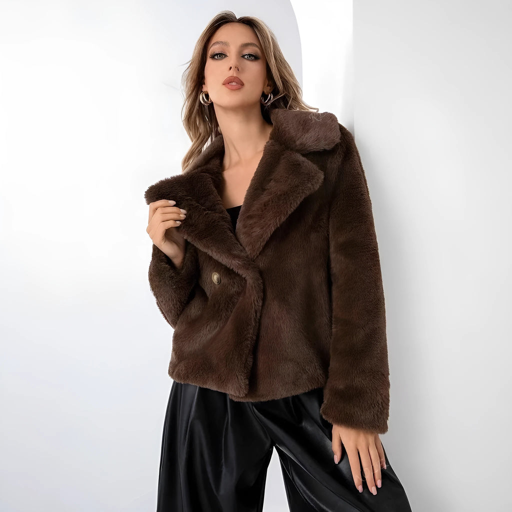 Rose red women's short faux fur coat with a loose fit and regular sleeves on a hanger.