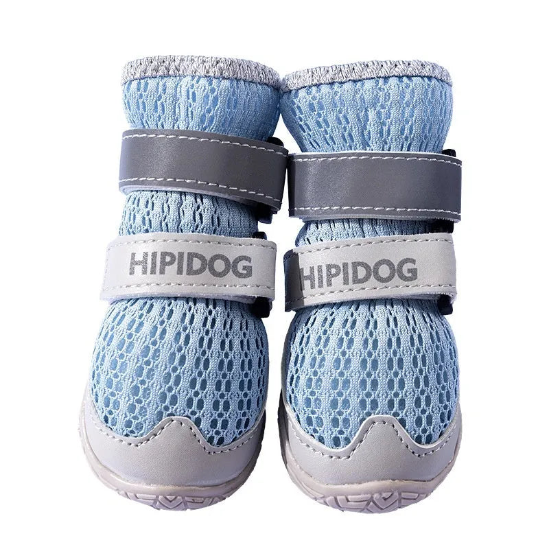 Pair of light blue cartoon-style dog shoes on a white background for summer paw protection.