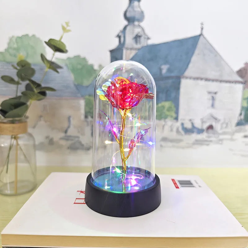 Glass cover small night lamp with plastic flowers in 15cm tall design with black base