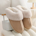 Women's brown plush indoor slippers with round toe, flat heel, and non-slip sole.