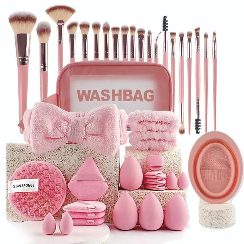 Beauty tool set with multiple pieces in brown, pink and purple colours for face wash and makeup application