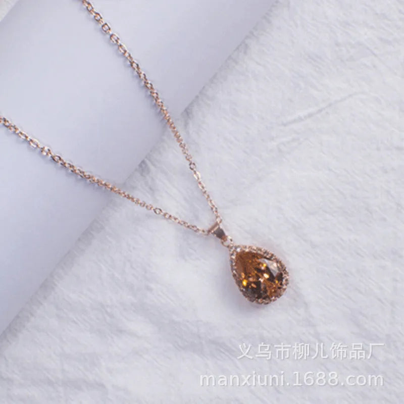 Pink rose gold drop shape rhinestone necklace with geometric design on alloy chain