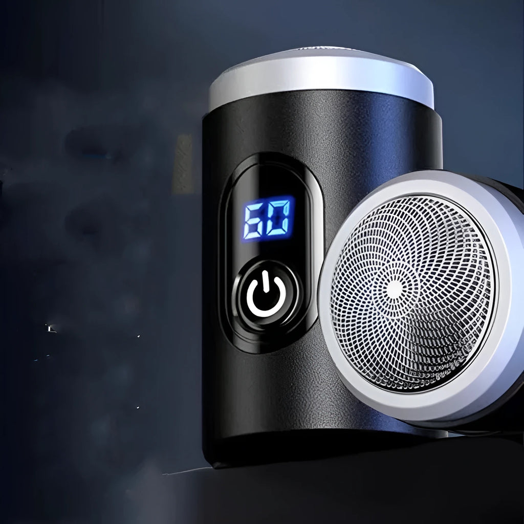 Black mini portable electric shaver with USB cable and cleaning brush on a white background.