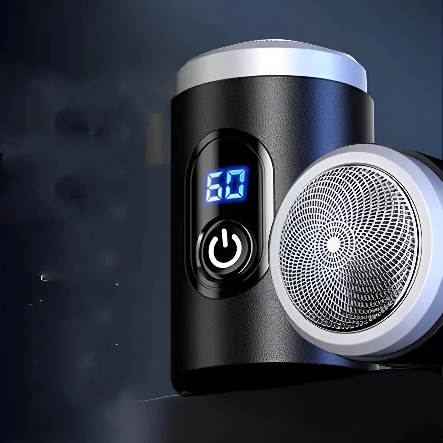 Black mini portable electric shaver with USB cable and cleaning brush on a white background.