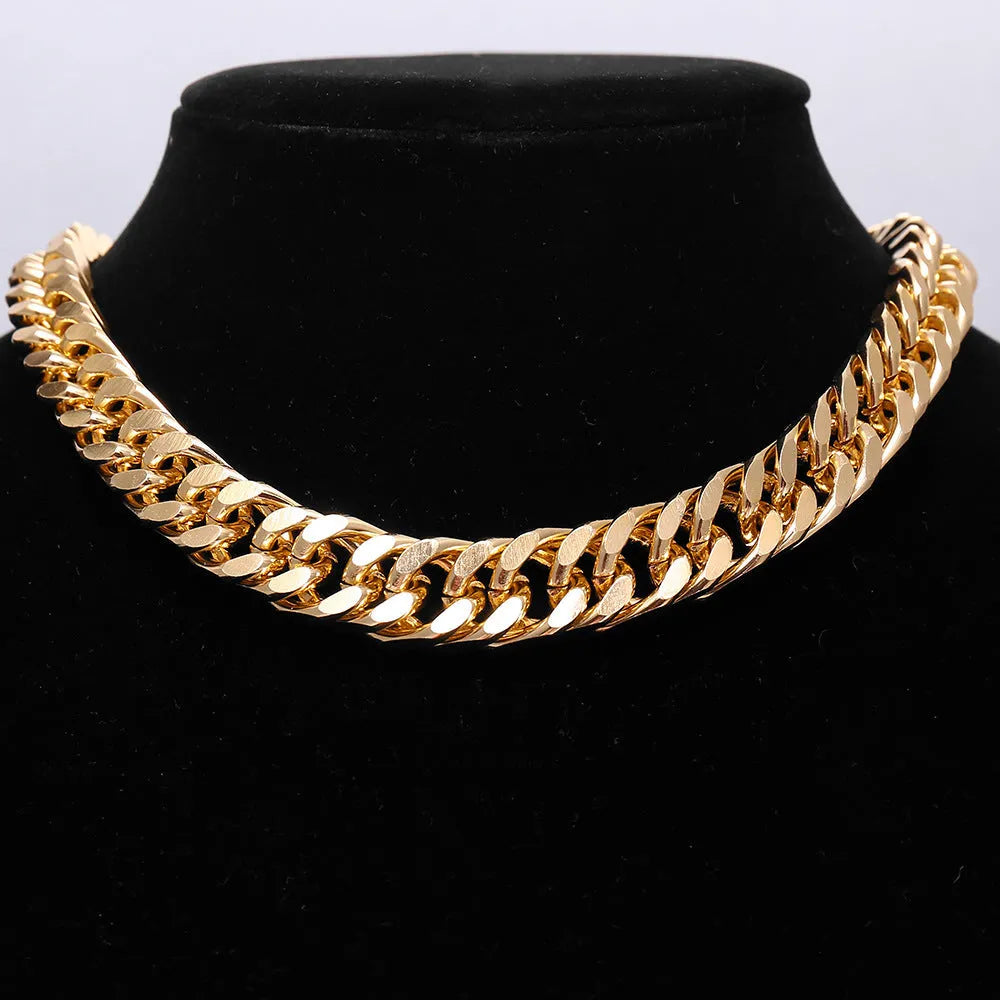 Women's gold chunky chain necklace showing thick links and pendant detail