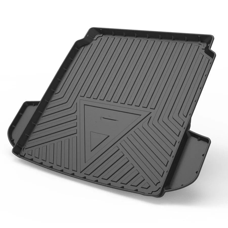 Black carbon fibre pattern TPE car trunk protector mat lying flat.