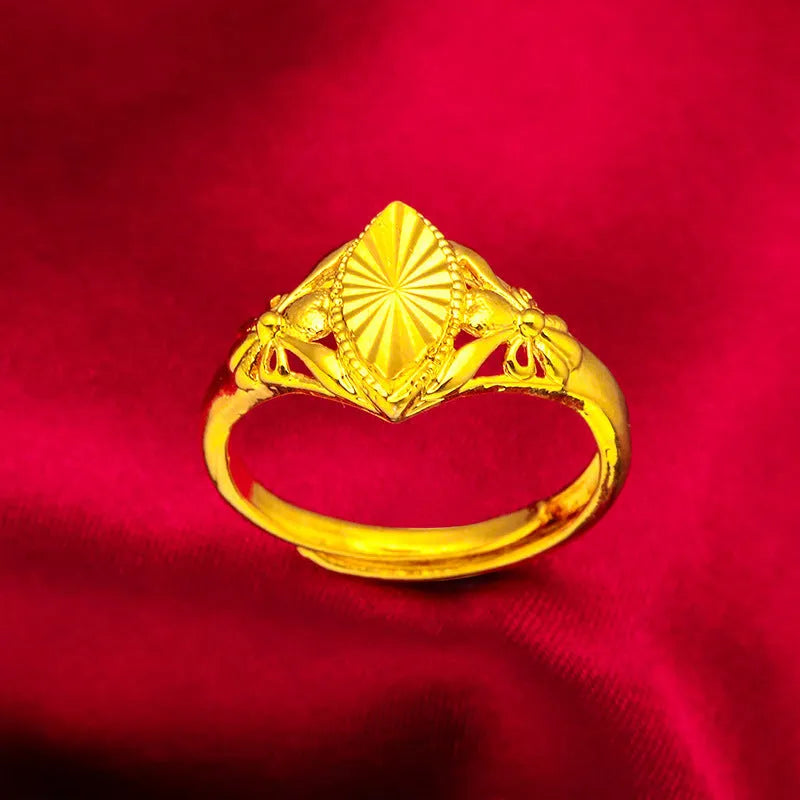 Gold colour brass ring with geometric open diamond flower design and textured details