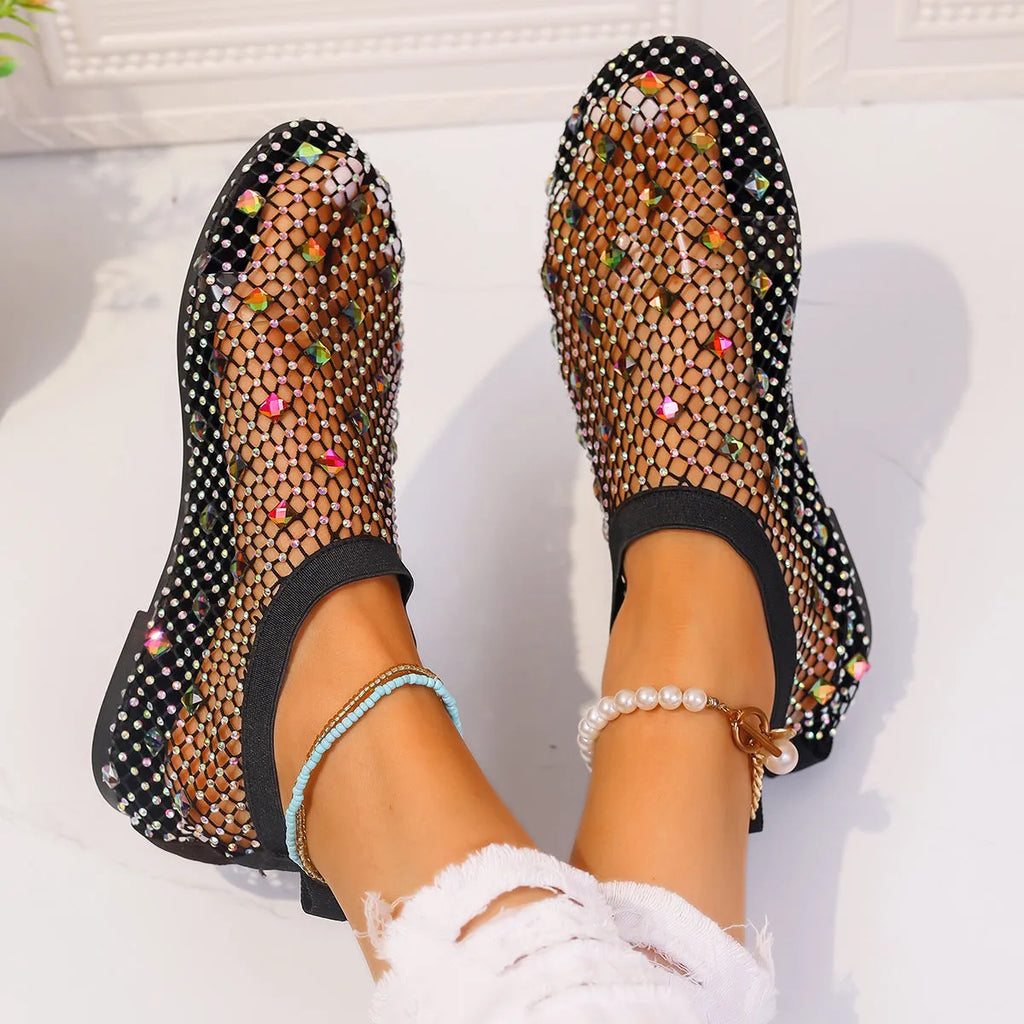 Women's flat mesh sandals with colourful rhinestone decoration on the upper and a round toe.