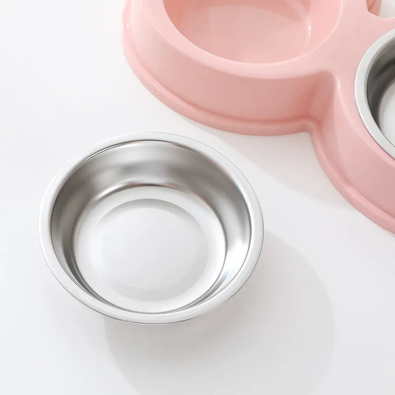 Stainless steel pet double bowl with food and water compartments in blue, green, and pink colour options