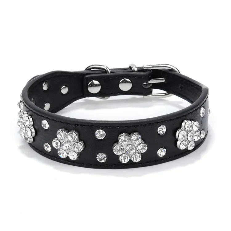 Black PU leather dog collar with silver rhinestone flower pattern and metal D-ring for small dogs.