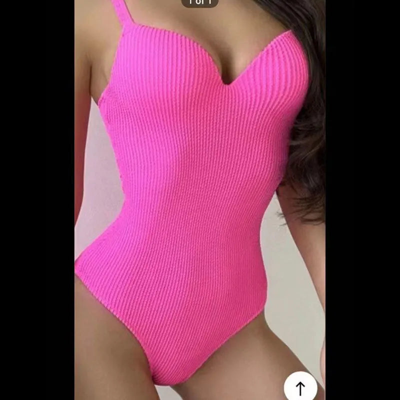 Women's sleeveless one-piece swimsuit with sunken stripe design in black, red, green, or purple