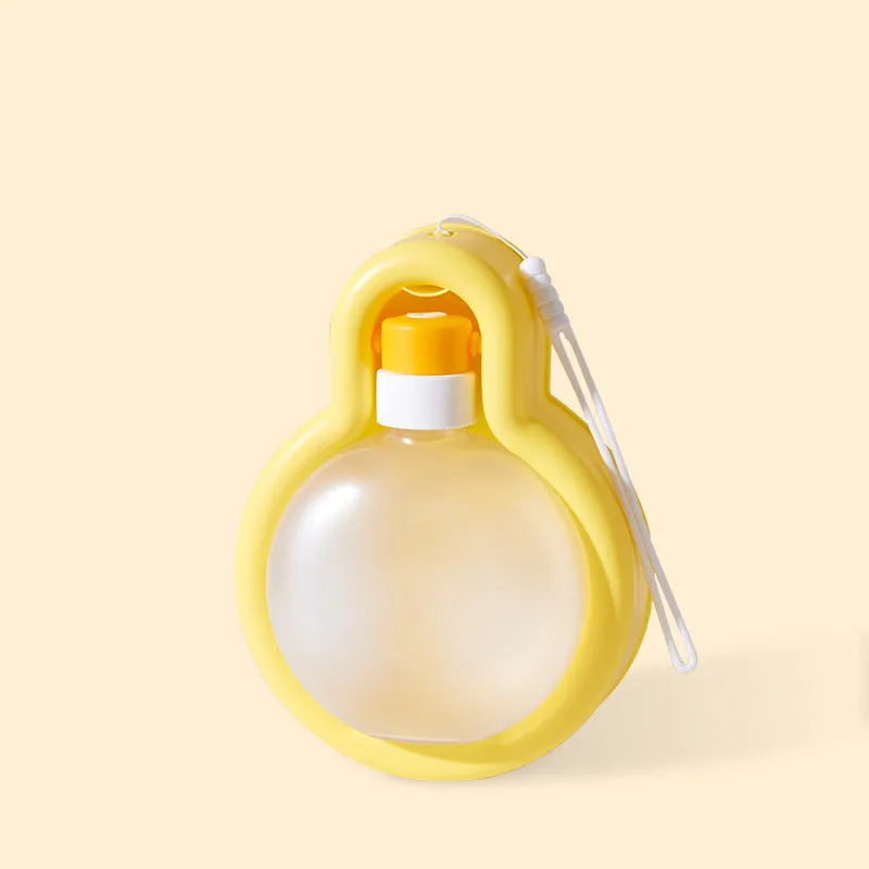 Green dog travel water bottle with built-in silicone drinking bowl, shown with bowl extended.