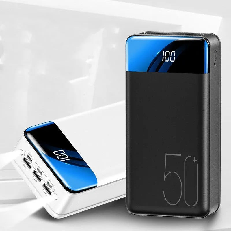 Large capacity 50000mAh power bank with three USB ports in black or white plastic casing