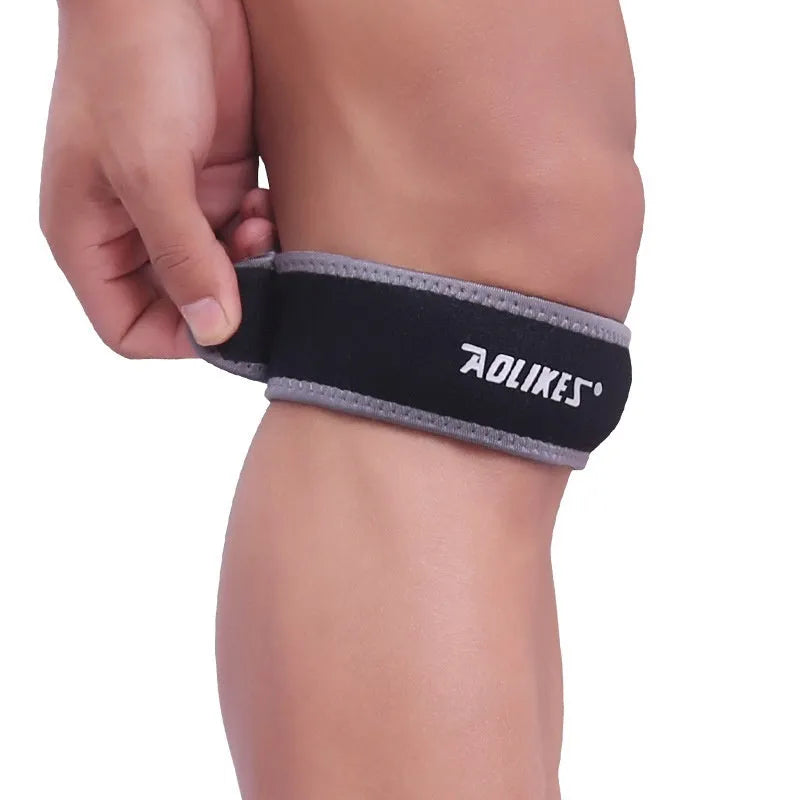 Black and grey patella retinaculum knee pad for sports protection