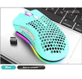 BM600 hollow out wireless gaming mouse with RGB lights in cyan colour on a desk