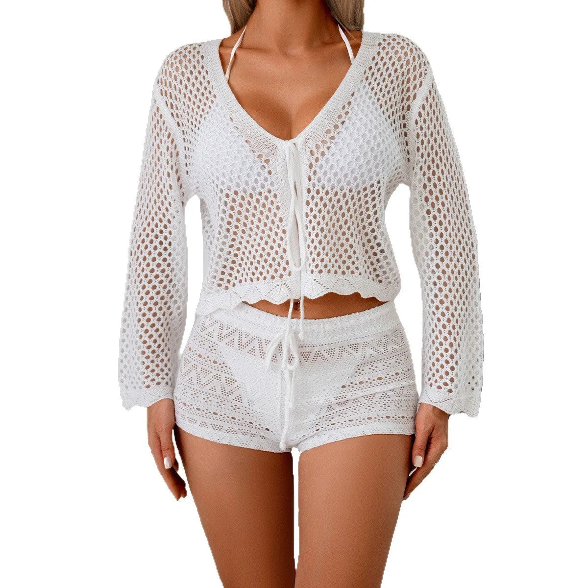 Women's apricot hollow knit cardigan blouse with bell sleeves laid flat.