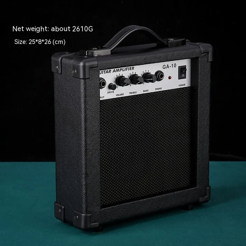 Small and easy to carry guitar audio amplifier with metal plastic construction, 25 by 8 by 26 cm