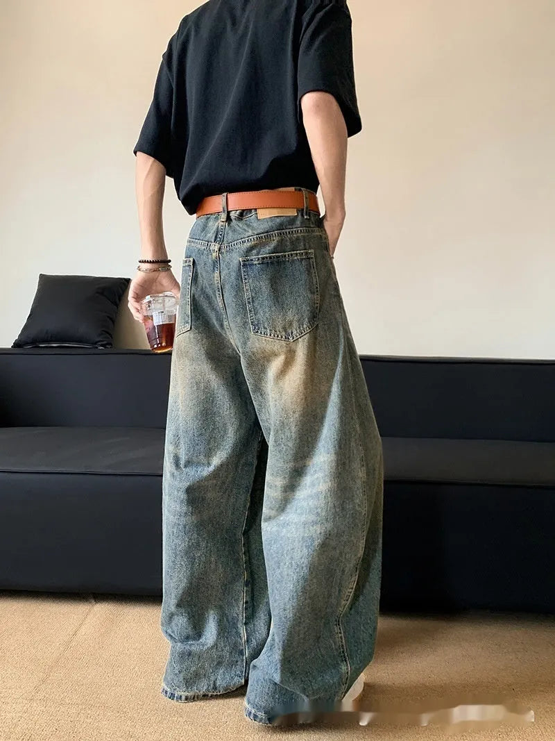 Men's retro blue distressed jeans with wide-leg cut and micro-elastic cotton blend fabric