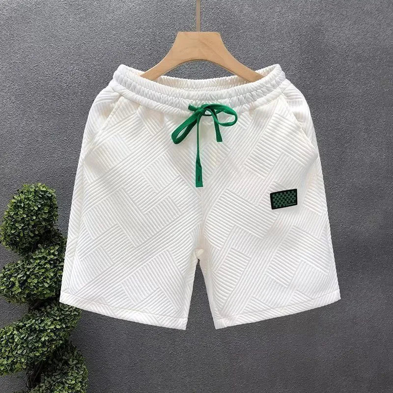 Polyester sports shorts in solid colours with micro elasticity for casual wear and beach activities