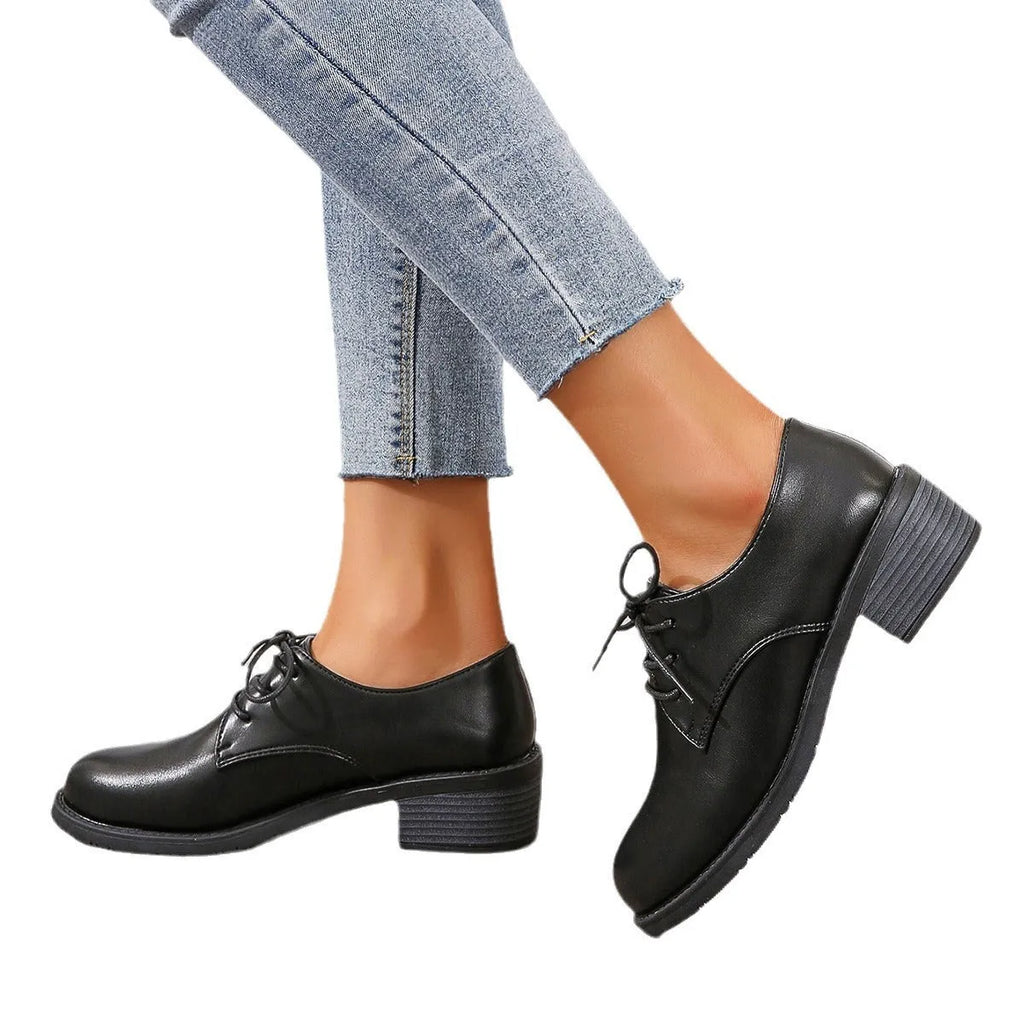 Black women's leather work shoes with thick chunky heel and pointed toe